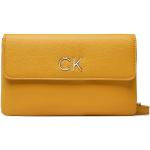 Dámske Designer Crossbody kabelky Calvin Klein žltej farby z koženky v zľave 