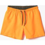 Chlapčenské Detské plavecké šortky koton horčicovej farby v zľave 