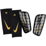 Futbalové chrániče Nike Mercurial zlatej farby v zľave 