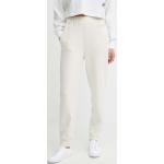 Dámske Designer Športové oblečenie Calvin Klein béžovej farby s jednofarebným vzorom z bavlny vo veľkosti XS 