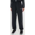 Dámske Designer Športové nohavice Calvin Klein PERFORMANCE čiernej farby s jednofarebným vzorom z polyesteru vo veľkosti XS 